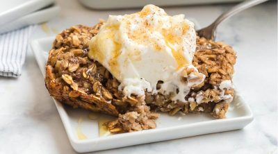 slice of baked banana bread oatmeal with almond yogurt and agave