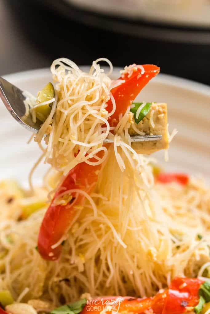 bite of noodles and veggies on a fork