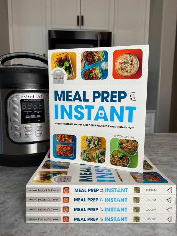 Stack of books next to an Instant Pot