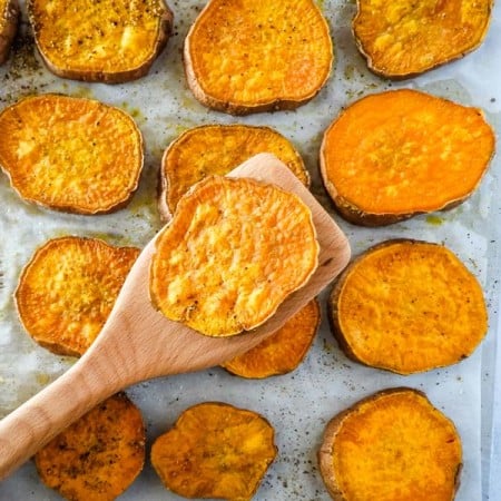roasted sweet potato round on a wooden spatula
