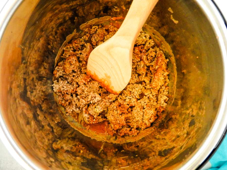 Overhead photo of cooked ground beef in the Instant Pot with taco seasoning