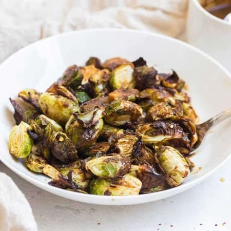 teriyaki brussels sprouts in a white bowl