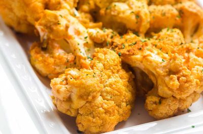close up of buffalo cauliflower on white plate