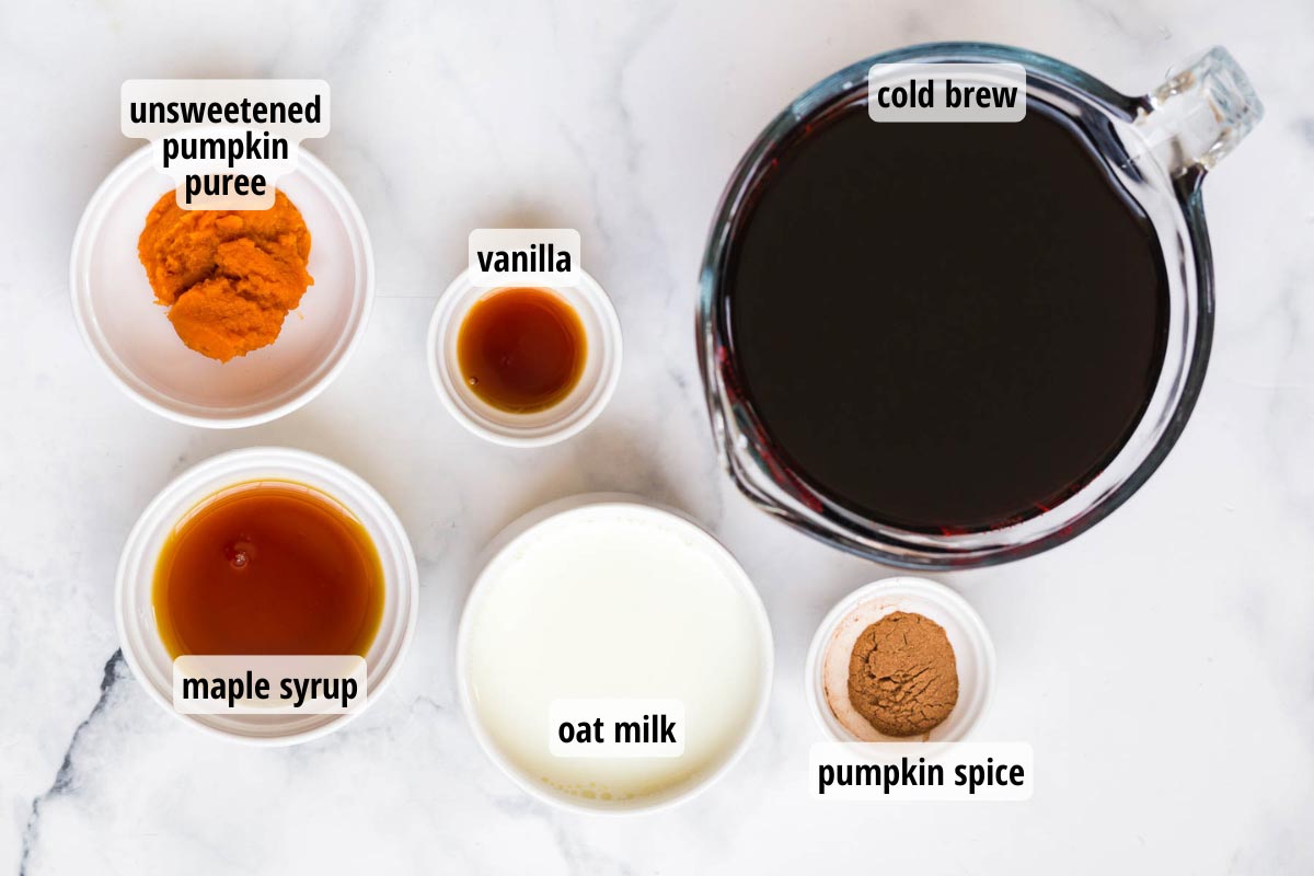 Ingredients in white and clear bowls that are needed to make this healthy pumpkin cream cold brew with cold foam. 