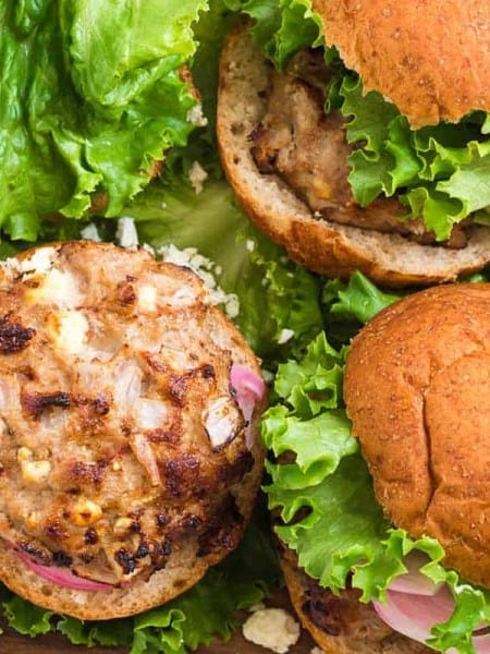 ranch turkey burgers on a bed of lettuce and in whole grain buns