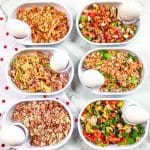 Six white dishes with six different flavors of Just Crack an Egg recipes in them.