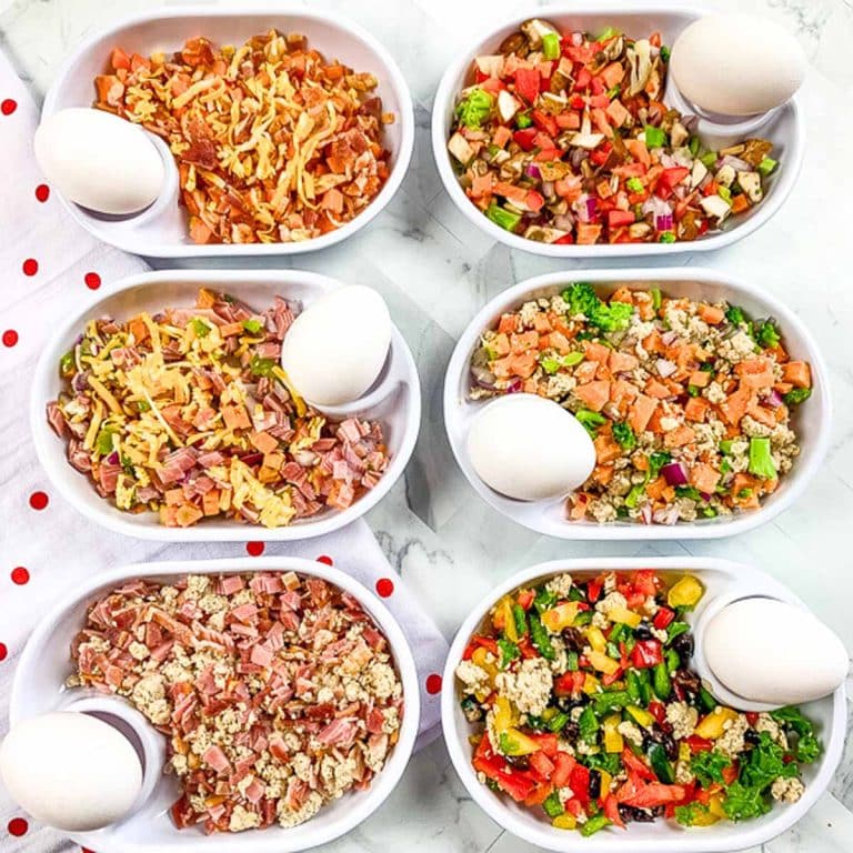 Six white dishes with six different flavors of Just Crack an Egg recipes in them.