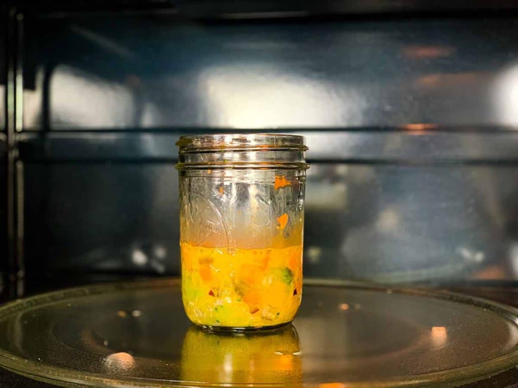 mason jar in the microwave with an egg mixture
