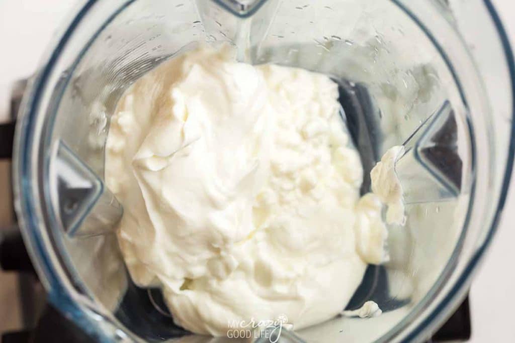 top down view of cottage cheese and greek yogurt in a blemder