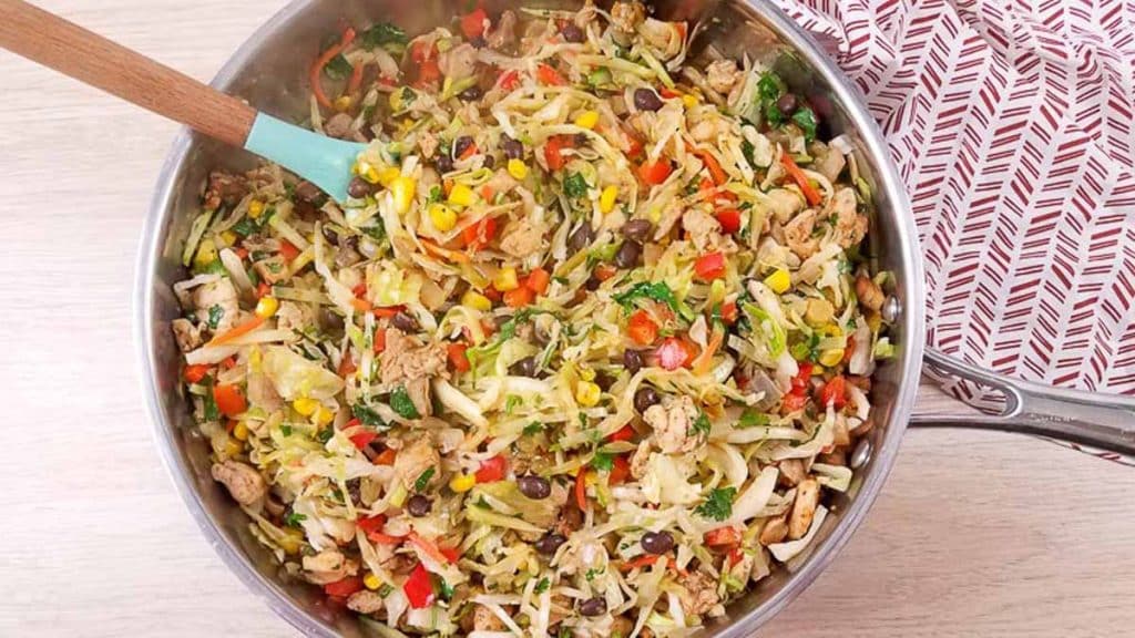 top down view of stainless steel pan and ww egg roll in a bowl (southwest style) cooked inside