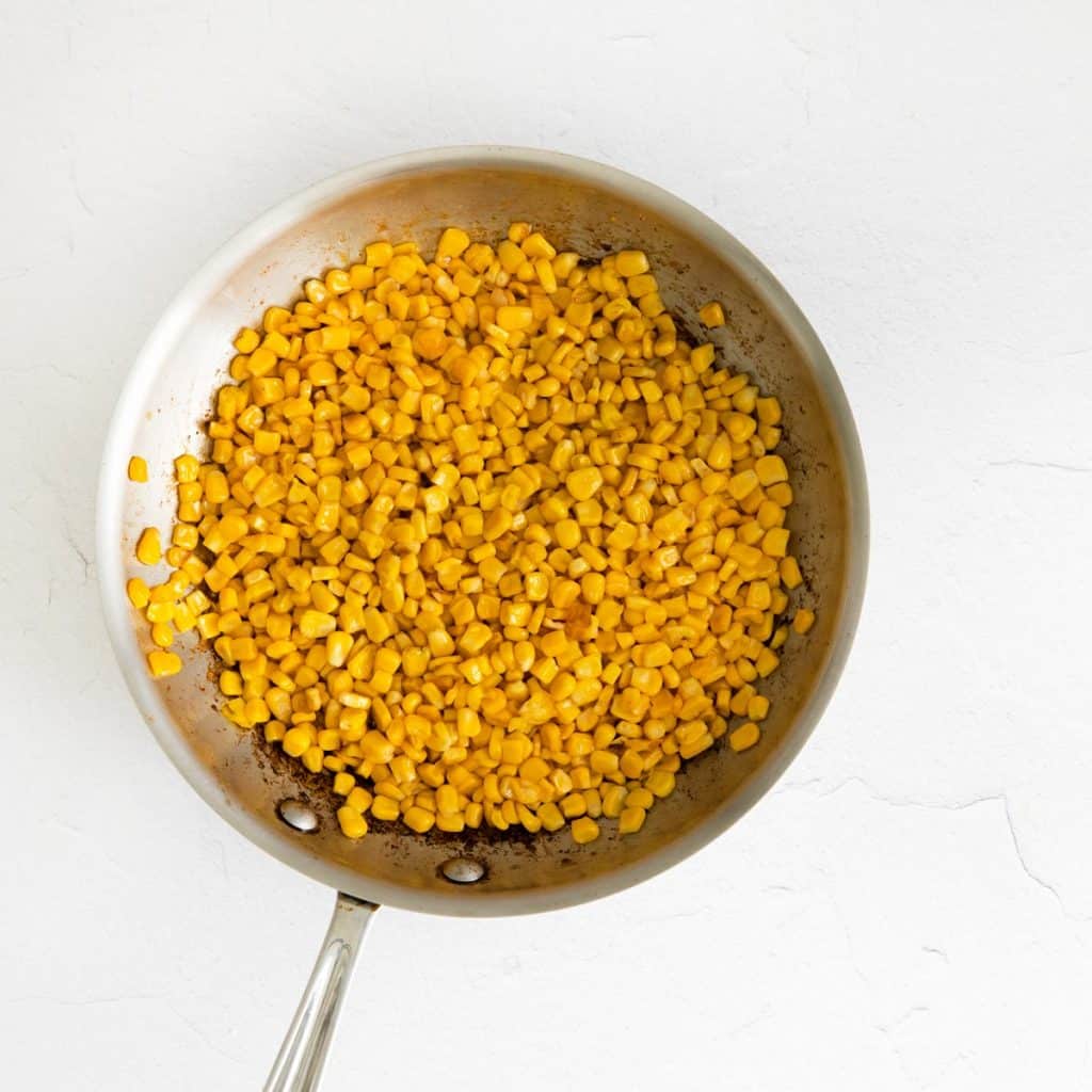 Corn inside of a skillet.