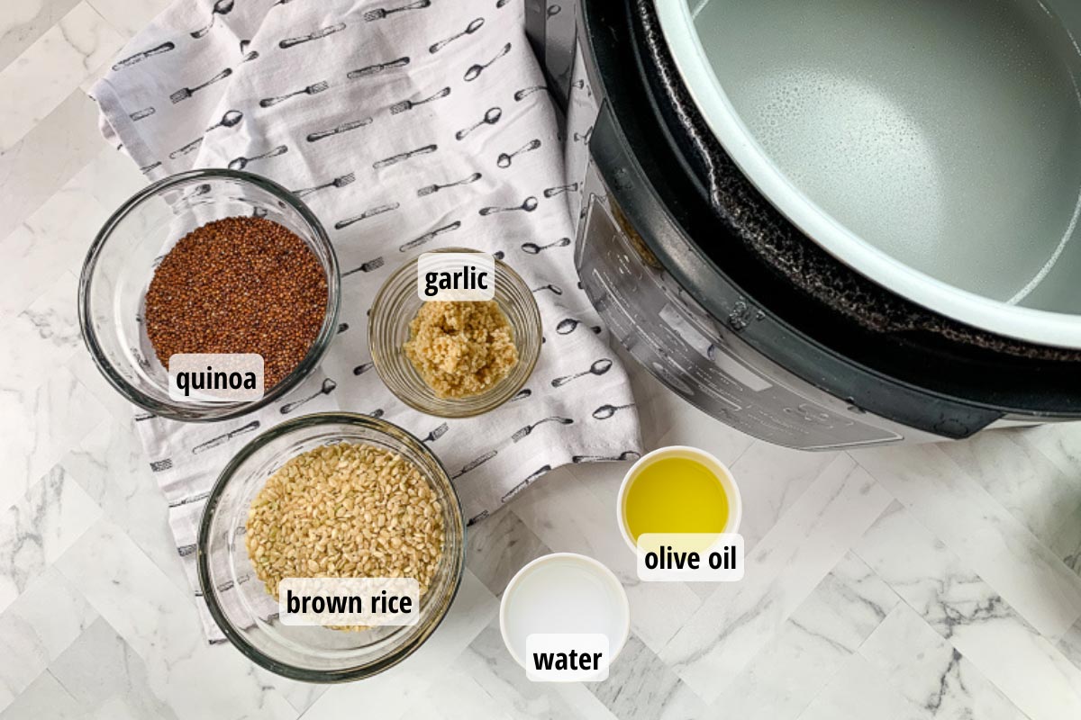 Ingredients in white and clear bowls for Quinoa and Brown Rice. 