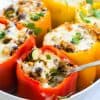 fork scooping into stuffed peppers