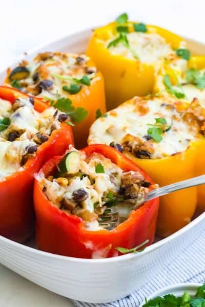 fork scooping into stuffed peppers