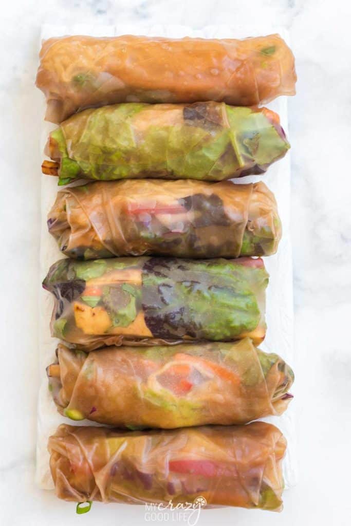 white tray of fresh spring rolls in brown rice wrappers