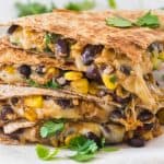 close up of pieces of veggie quesadillas, stacked on top of one another