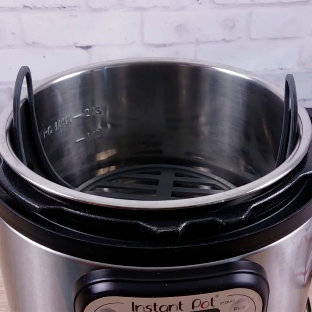 An Instant Pot with a trivet inside of it.
