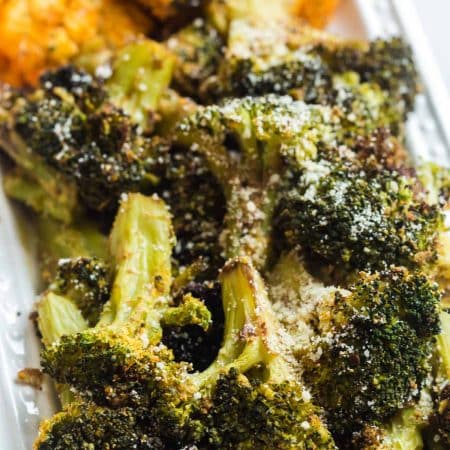 Air Fried broccoli and cauliflower on a white dish, cooked in the air fryer.
