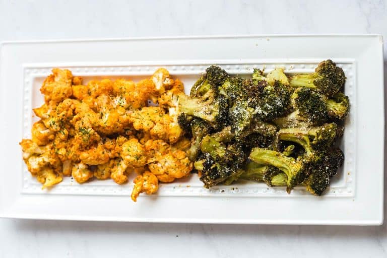white rectangular plate with air fried cauliflower on the left, and air fried broccoli on the right.