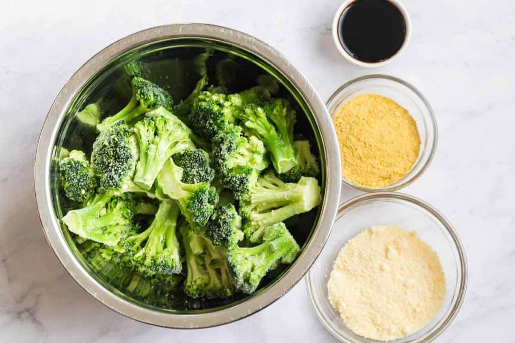 multiple bowls of ingredients for broccoli recipe