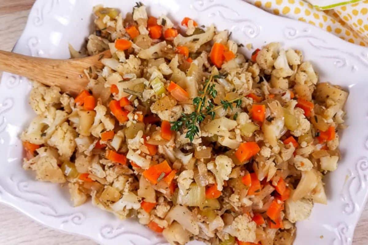 A white platter with cooked cauliflower stuffing.