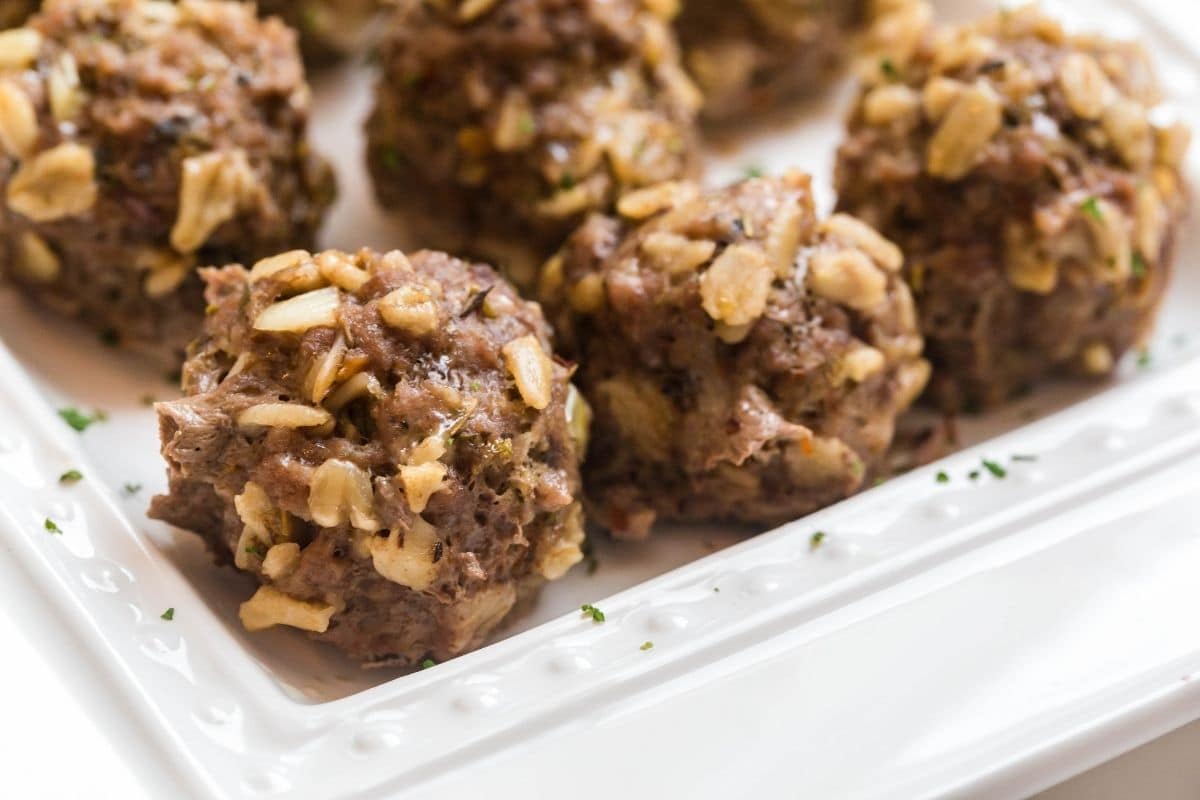 A white platter with instant pot meatballs.