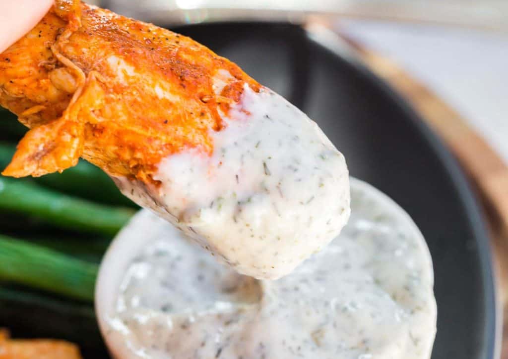Instant Pot Buffalo Chicken Bites being dipped into ranch dip