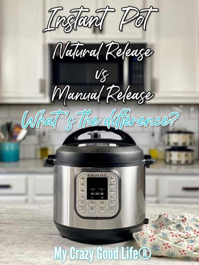 Instant Pot pressure cooker on marble counters with a patterned tea towel to the right of the pot. Blurred wall in the background with microwave, spice racks, and a utensil caddy.