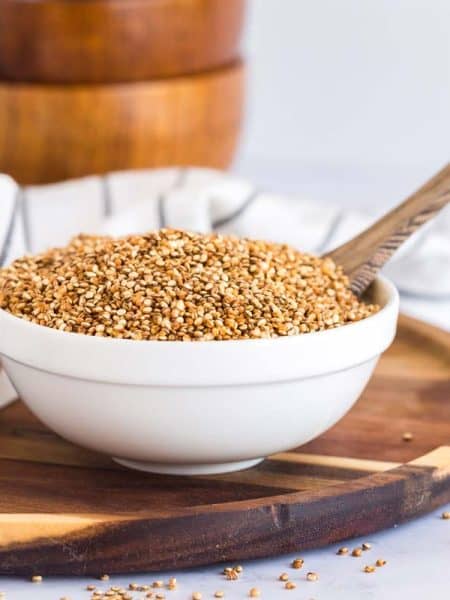 bowl of crispy quinoa on a wooden plate