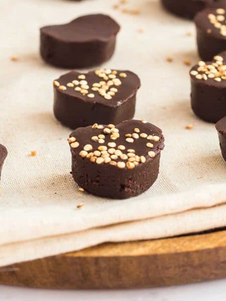 Homemade Vegan Chocolate Recipe on parchment paper, on top of a cutting board.