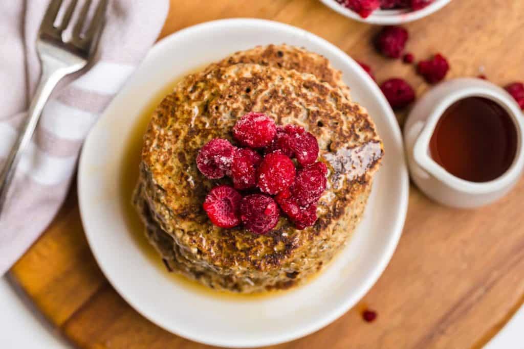 aerial view of Vegan Whole Wheat Pancakes with raspberries on top