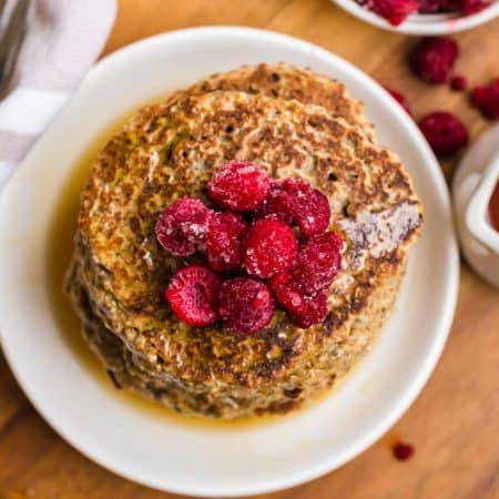 aerial view of Vegan Whole Wheat Pancakes with raspberries on top