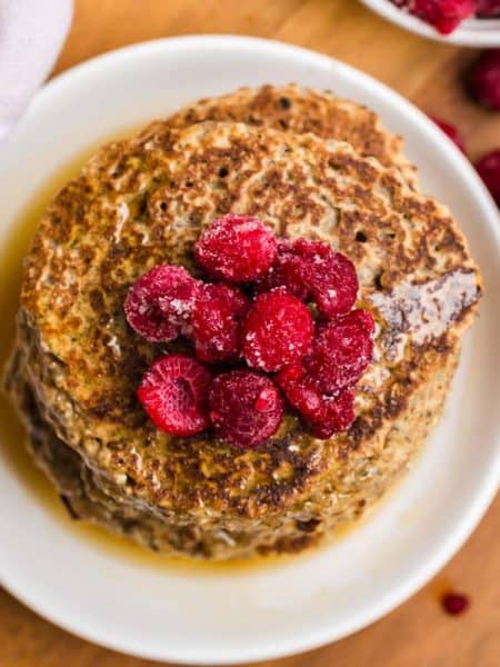 aerial view of Vegan Whole Wheat Pancakes with raspberries on top