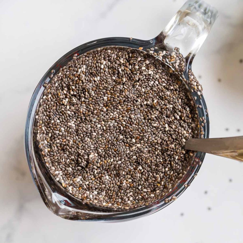 chia seeds soaking in a pyrex measuring cup