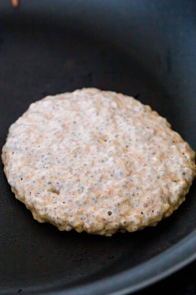 pancake being cooked on a black skillet