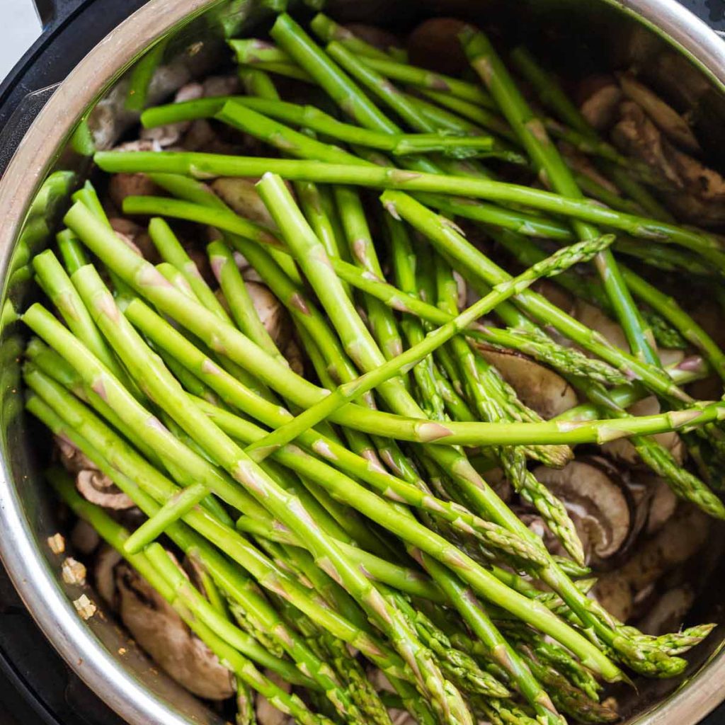 green beans on top of chicken and potatoes in an instant pot