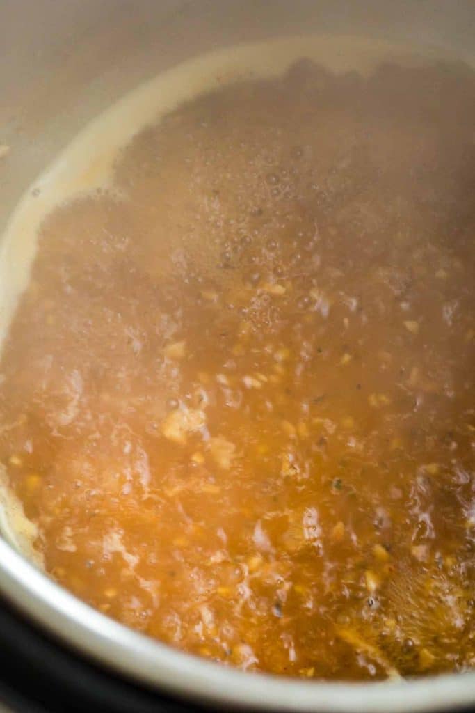 slurry of cornstarch and broth bubbling in an instant pot