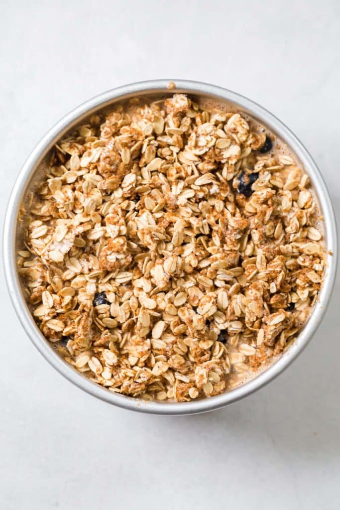 Blueberry Oatmeal Bake in a circular pan ready to be cooked in the instant pot