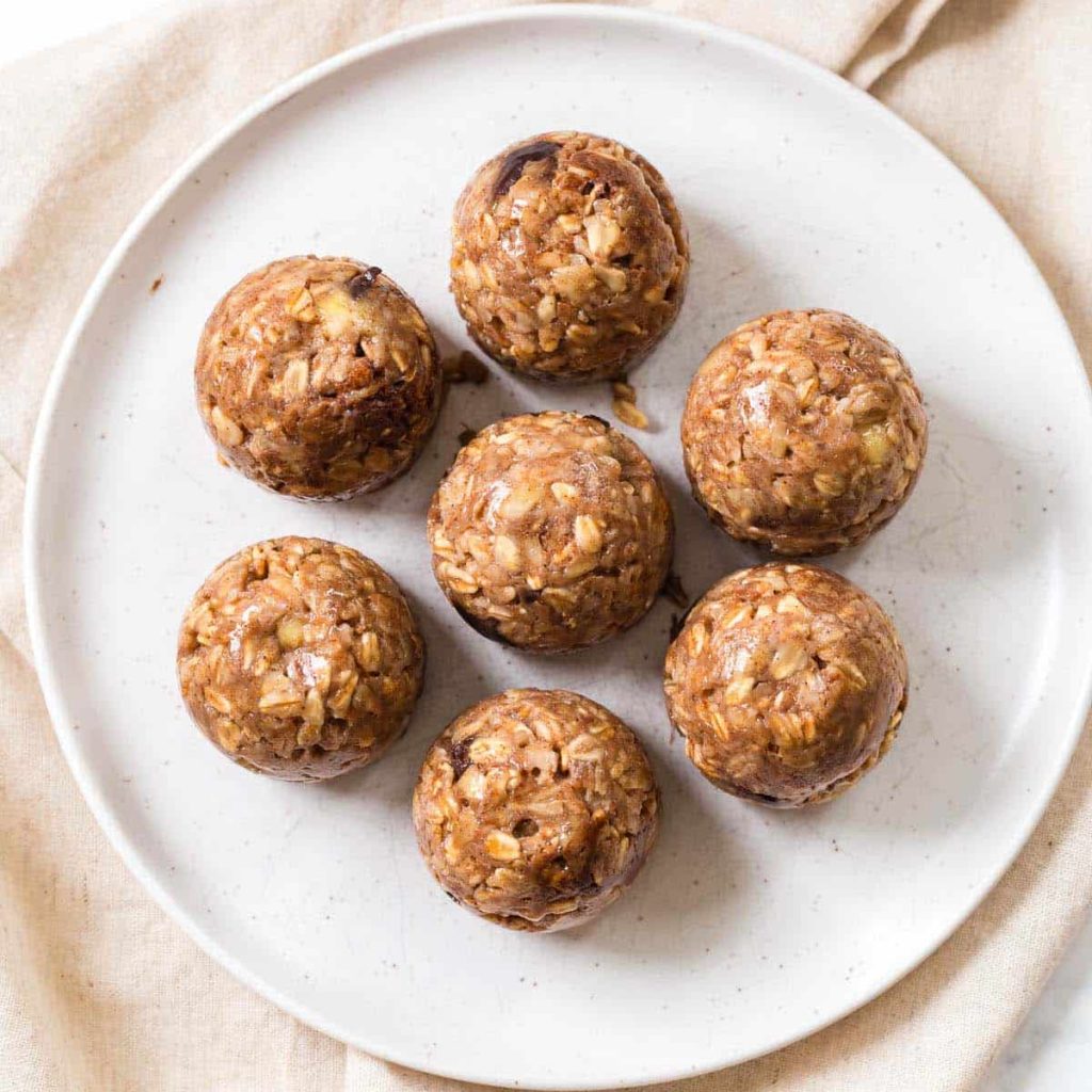 7 banana oatmeal bite balls on a white plate