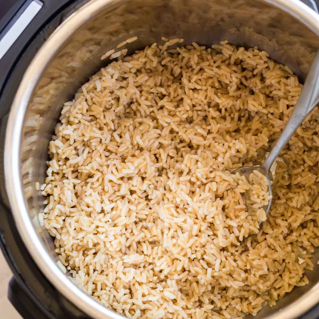 top down view of instant pot with uncooked brown rice