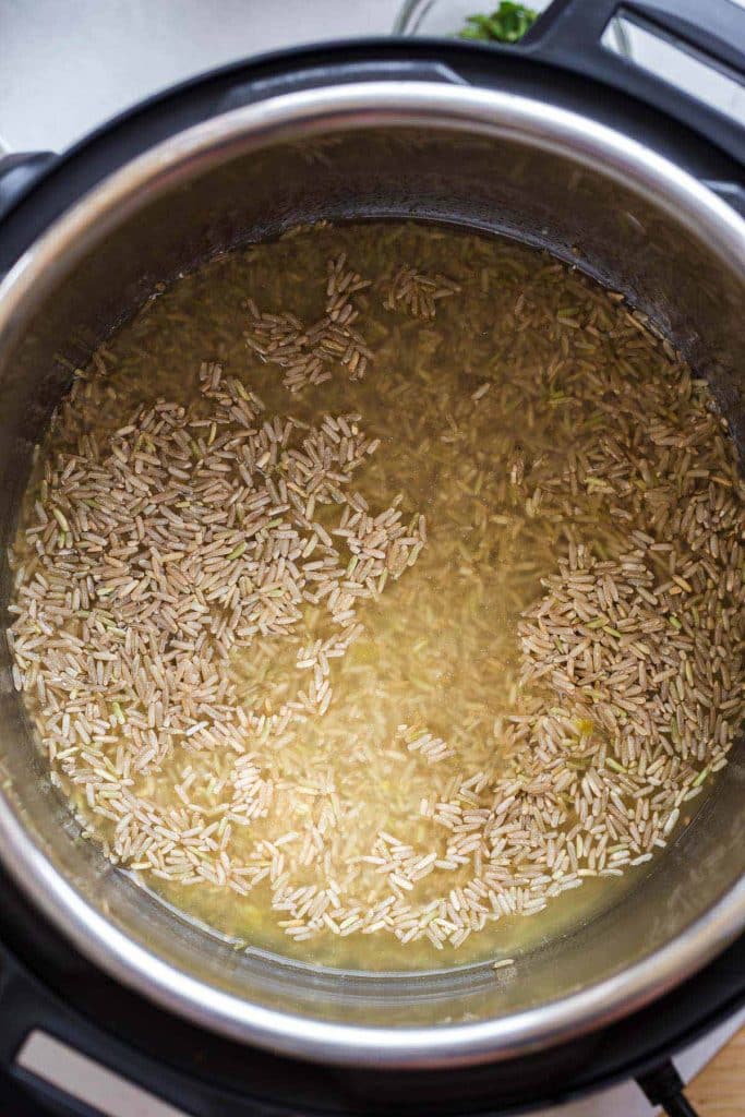 crown rice and broth in an Instant pot