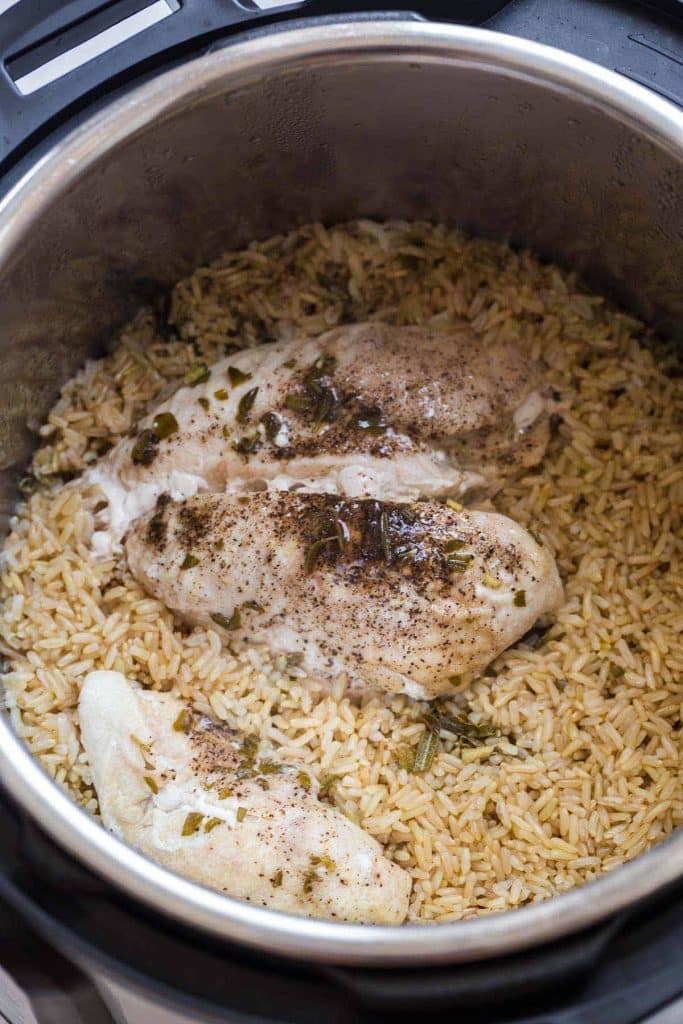 cooked chicken and brown rice inside of Instant Pot