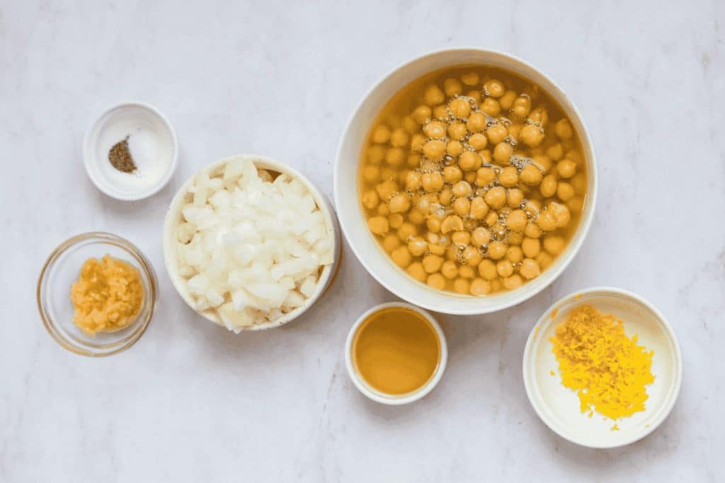 bowls with onion, garlic, avocado oil, salt and pepper, chickpeas and lemon zest