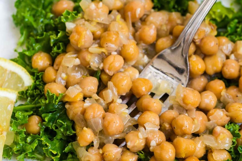 close-up of lemon garlic chickpea salad with fork