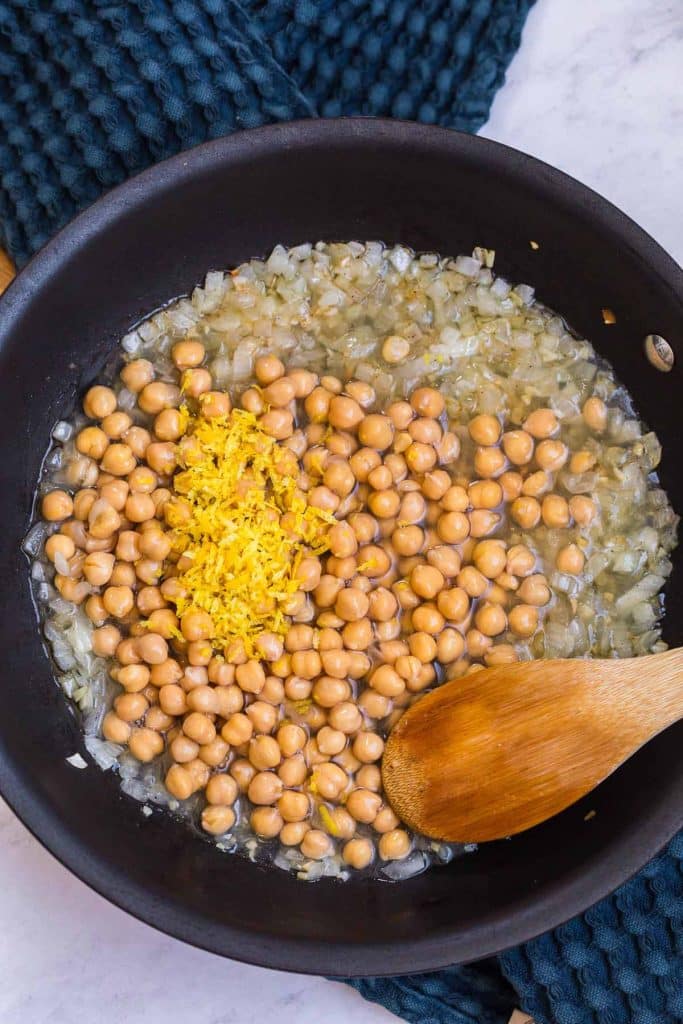 sautéed onions with can of chickpeas and lemon zest