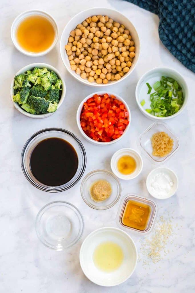 small bowls filled with ingredients to make sticky sesame chickpeas and veggies