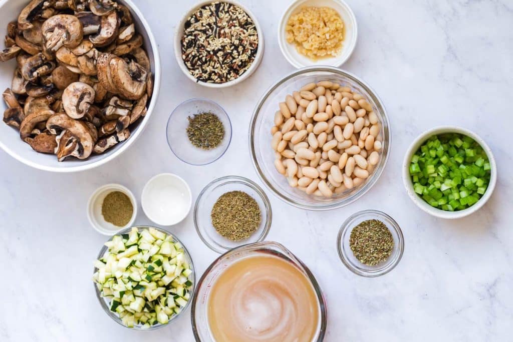 ingredients for Wild Rice and Mushroom Soup in glass bowls