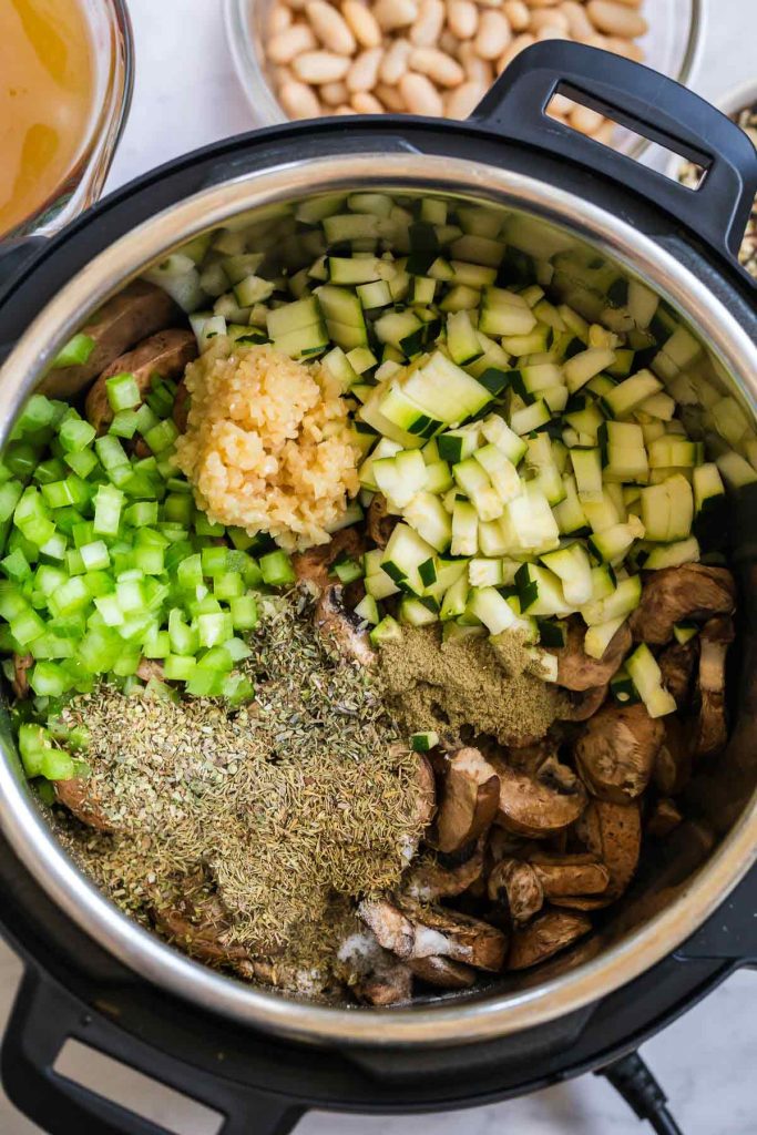 diced vegetables and herbs in the instant pot