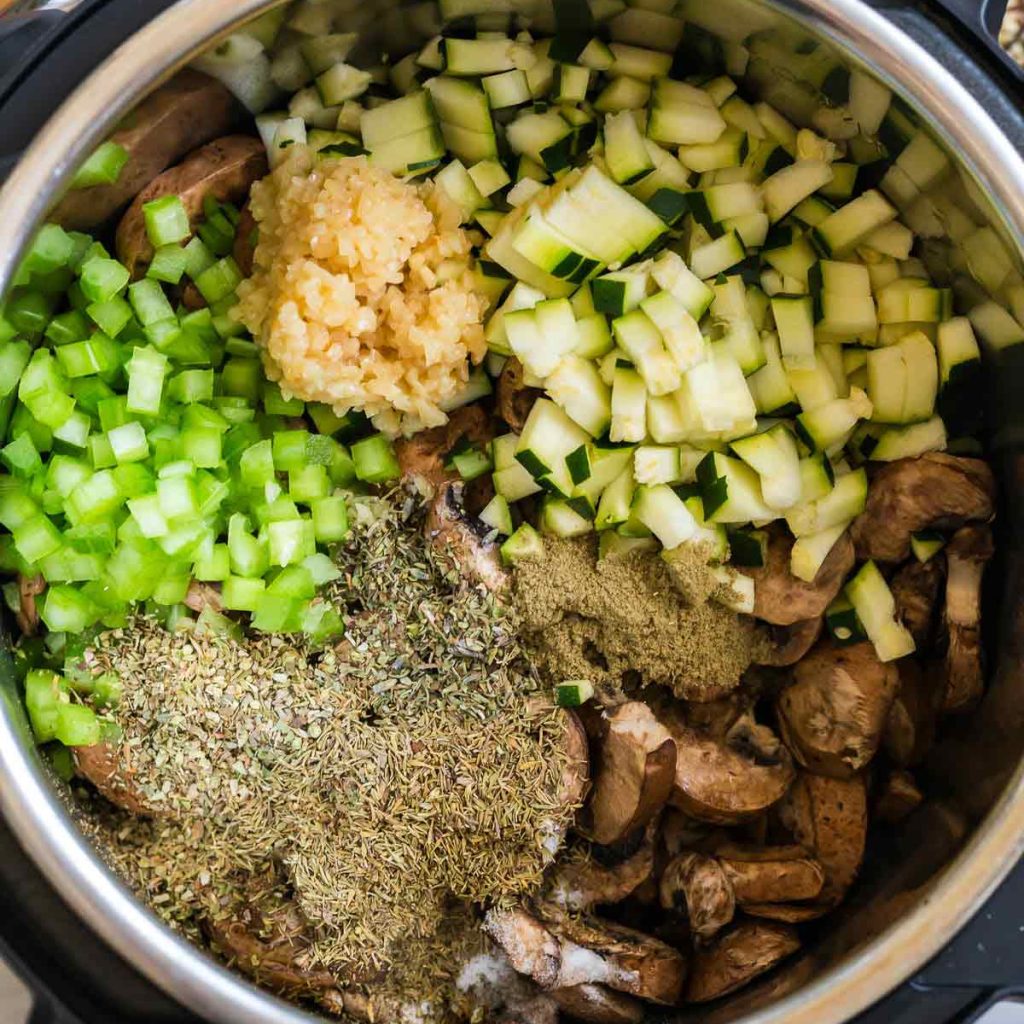 diced vegetables and herbs in the instant pot