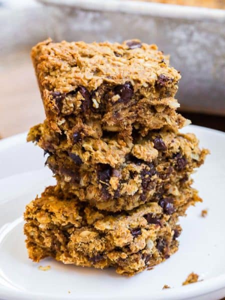 stack of three Peanut Butter Banana Oatmeal Bars on a white plate